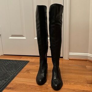 Gently worn over the knee boots. Leather in front and elastic material in back.